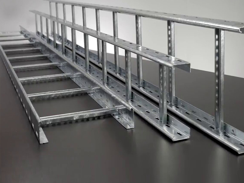 Metal cable trays arranged on a dark surface, showcasing industrial design and efficient cable management solutions for construction projects.